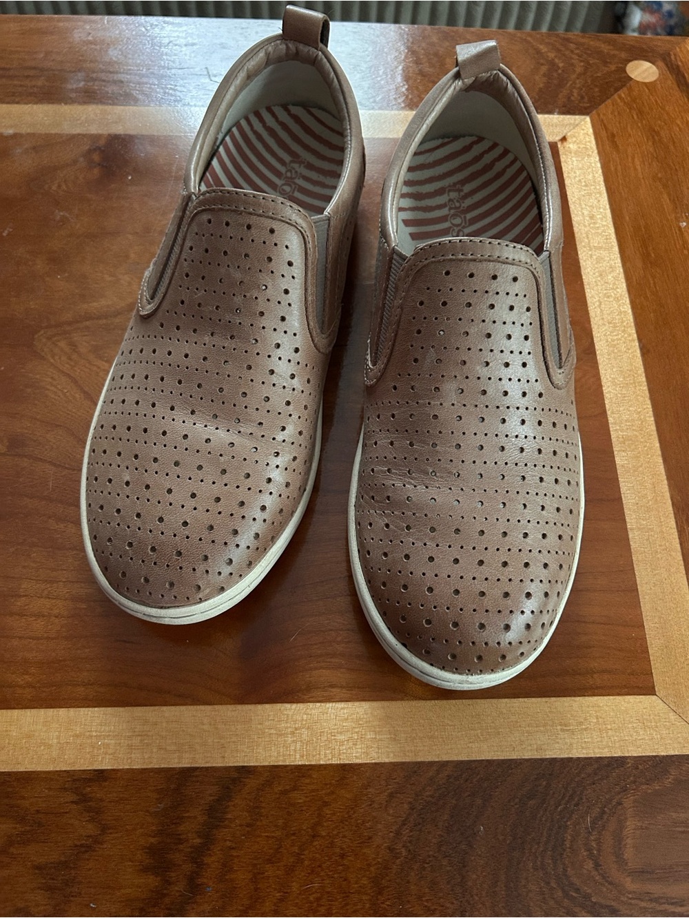 Taos slip on perforated leather sneaker shoes